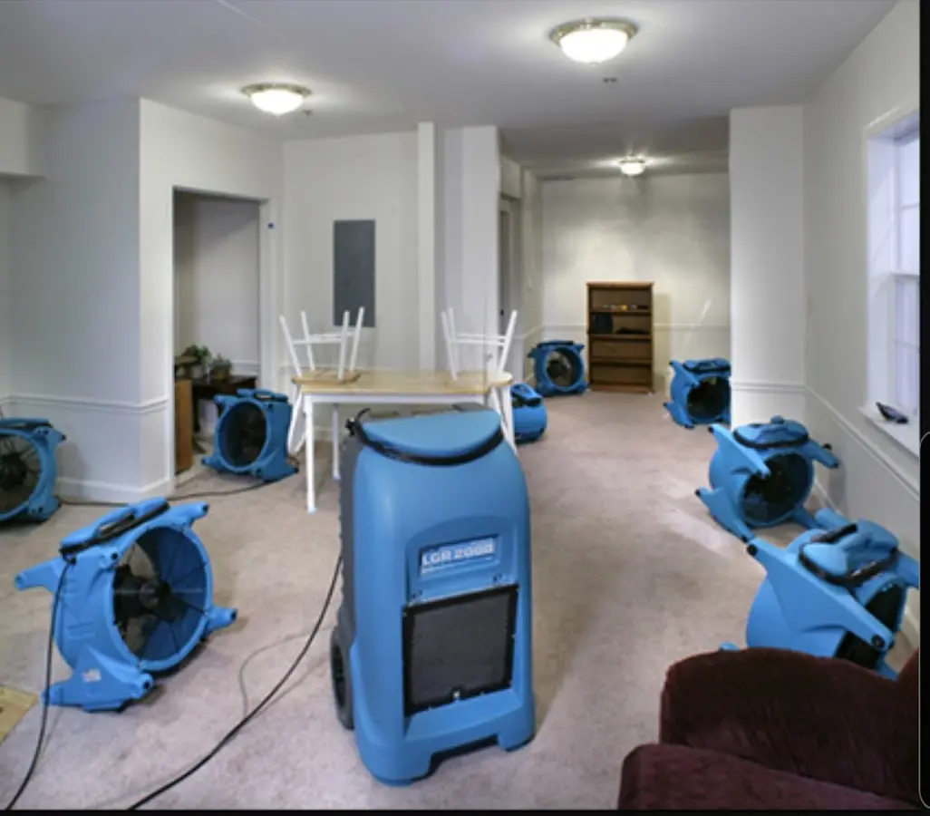 Air movers and dehumidifier setup for Water Damage Restoration in Poteau