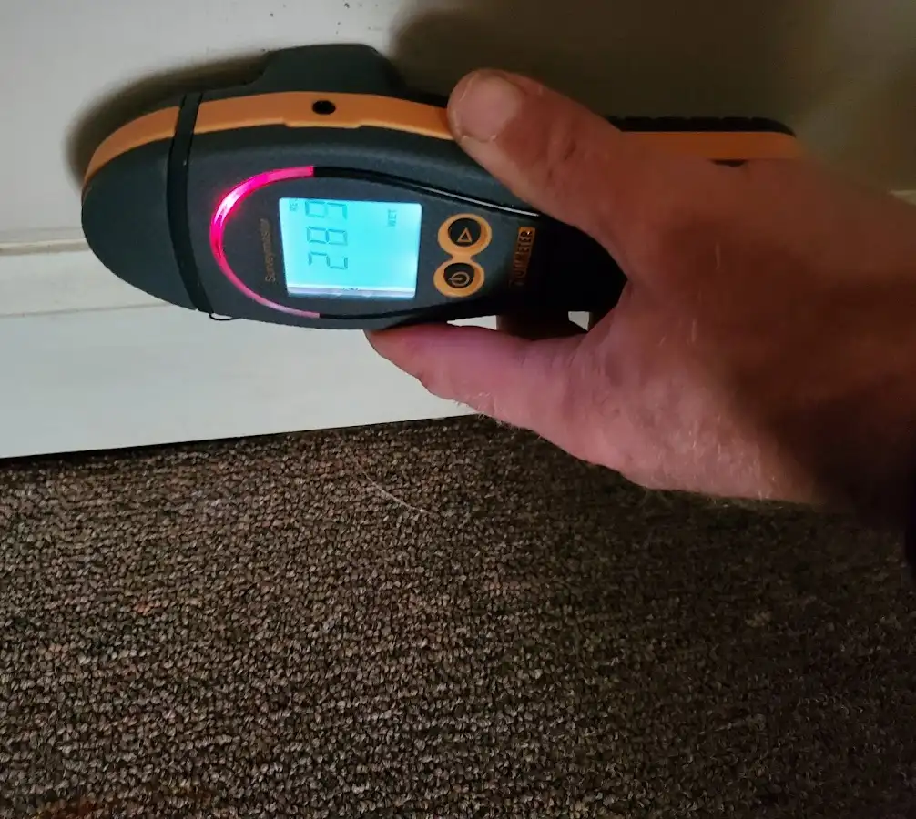 Moisture detection at baseboard during Sewage Cleanup & Sanitation in Poteau